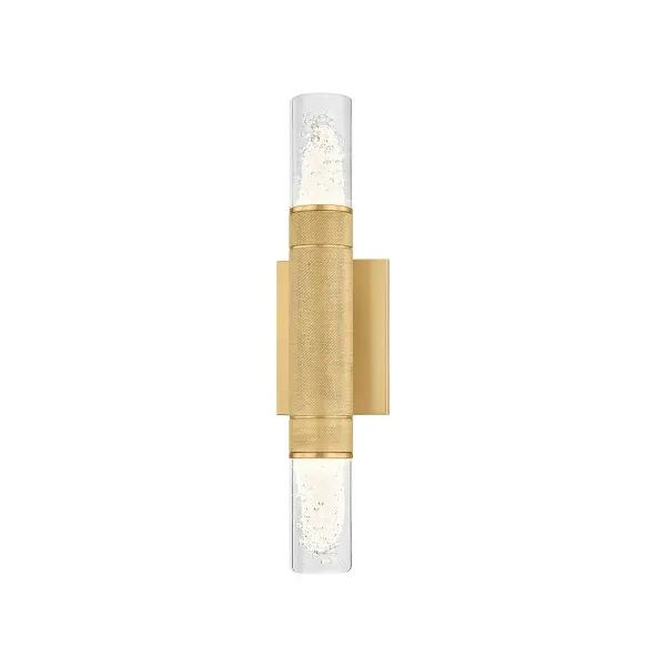 The Glen Cove wall sconce delivers sophisticated lighting with its distinctive knurled brass stem and clear seeded glass shades. Its compact 17-inch height and bi-directional light output make it ideal for flanking mirrors or creating symmetrical wall displays.