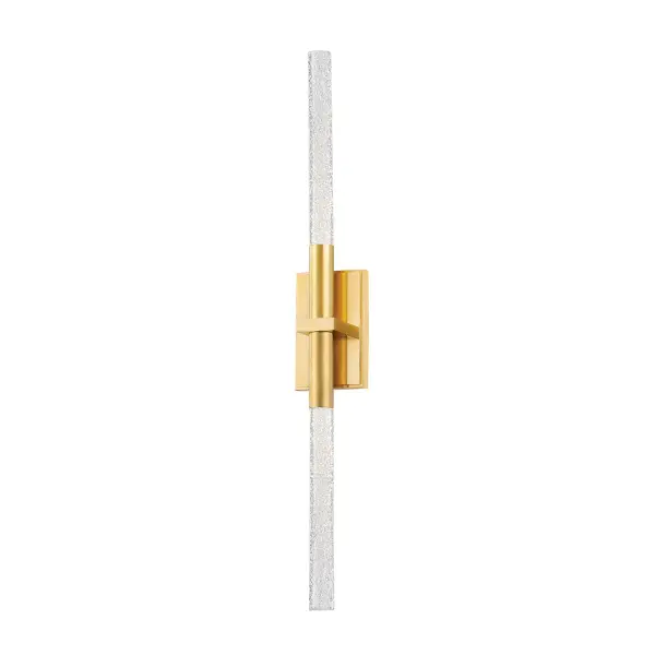 The Millerton sconce combines artistic glass craftsmanship with modern LED efficiency. Solid glass rods with intentional seedy bubbles create a distinctive upward and downward light wash, making it ideal for contemporary bathrooms and hallways.