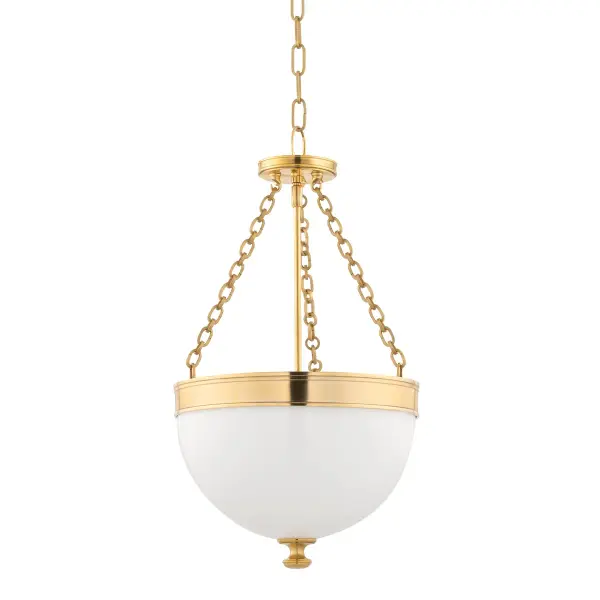 The Barrington pendant combines traditional elegance with versatile sizing, making it perfect for intimate dining spaces and kitchen islands. Its aged brass finish adds warmth and character to any room.