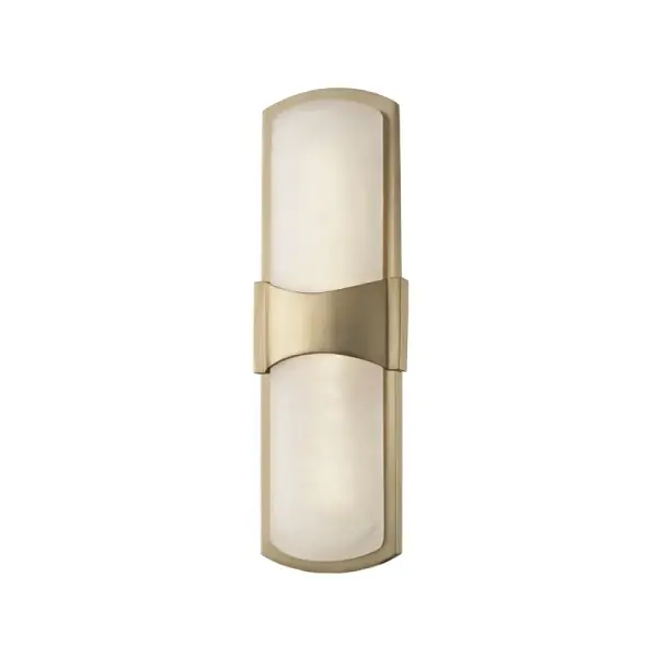 The Valencia wall sconce combines timeless elegance with modern LED efficiency. Its aged brass finish and alabaster shade create a warm, sophisticated glow perfect for intimate spaces. Compact at 5.25" wide, it's ideal for flanking mirrors or illuminating hallways.