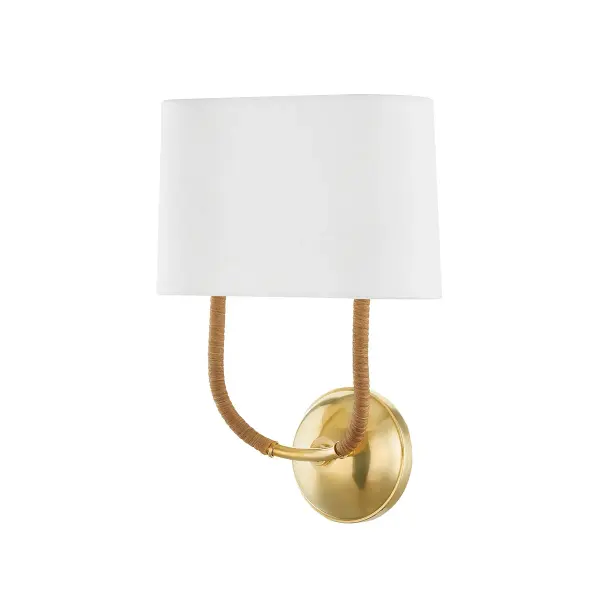 The Webson sconce beautifully blends traditional swooping arms with natural rattan detailing for a sophisticated yet relaxed aesthetic. The white linen shades soften the light while the aged brass finish adds warmth.