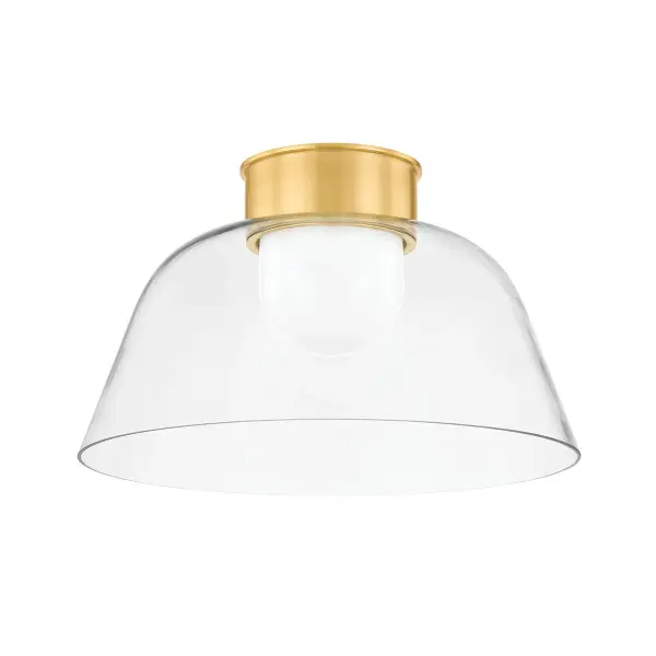 The Lakeside flush mount exemplifies refined simplicity with its graceful bowl-shaped design featuring dual glass layers and streamlined metalwork. The opal inner diffuser provides soft, even illumination while the clear outer glass adds depth and visual interest.