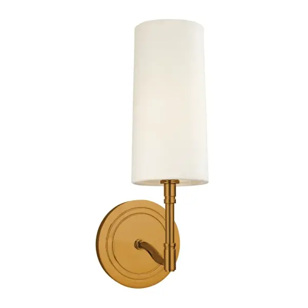 The Dillon wall sconce combines timeless design with versatile styling. Its aged brass finish and off-white linen shade create warm, diffused lighting perfect for intimate spaces. Compact at 4.5" wide, it fits beautifully in hallways and bathrooms.