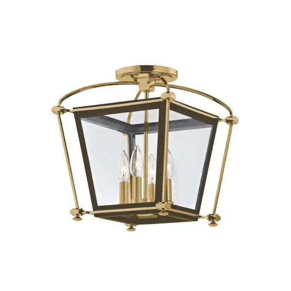 The Hollis semi-flush mount delivers traditional elegance in a compact 12.75-inch footprint. Its aged brass finish and clear glass shades create warm, inviting illumination perfect for smaller spaces with standard ceiling heights.