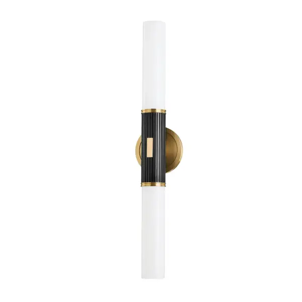 The Crewe wall sconce combines aged brass warmth with contrasting black bronze accents for a refined, elevated look. Its fluted glass shades and clean tubular design work beautifully in both traditional and contemporary settings.