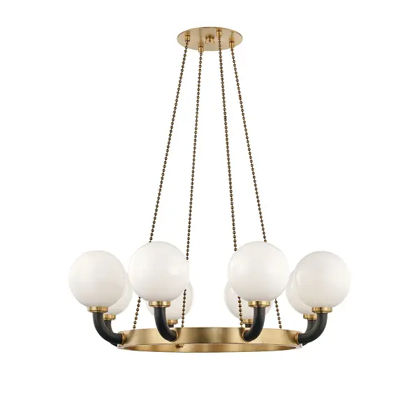 This substantial eight-light chandelier combines the warmth of aged brass with dramatic black accents, creating a sophisticated focal point. The generous scale and linear design make it ideal for larger dining spaces and kitchen islands.