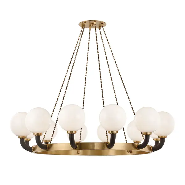 This substantial 12-light chandelier from Hudson Valley Lighting makes a bold architectural statement with its aged brass and black two-tone finish. The generous scale and sophisticated mixed-metal aesthetic work beautifully in transitional and contemporary interiors requiring dramatic overhead lighting.