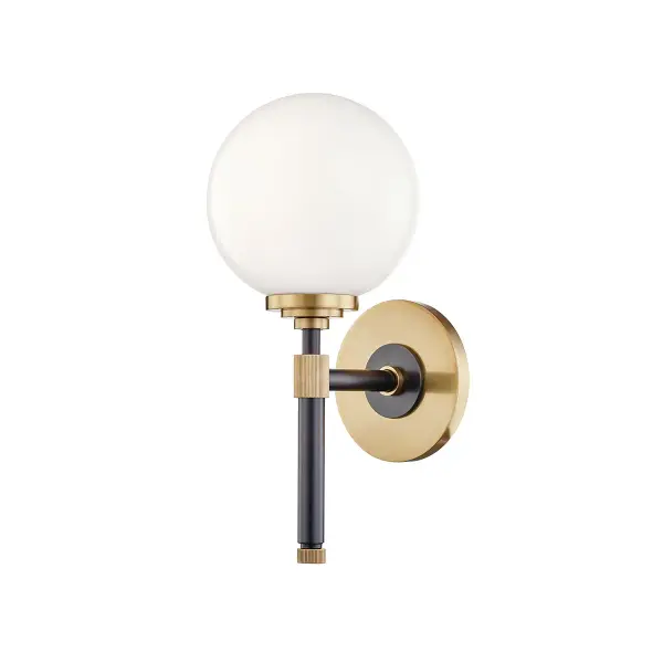 The Bowery bath bracket combines traditional styling with practical functionality. Its aged old bronze finish and opal glass shade deliver warm, diffused light ideal for vanity applications.