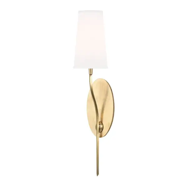 The Rutland wall sconce combines classic elegance with modern proportions. Its aged brass finish and faux silk shade create warm, diffused light perfect for hallways and bedrooms. The slender 5-inch profile works beautifully in tight spaces.
