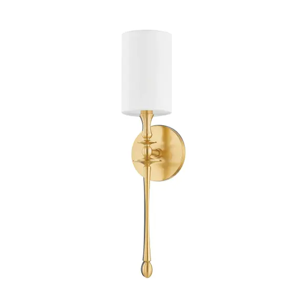 The Guilford wall sconce brings timeless sophistication with its elongated candlestick-inspired arm and crisp white linen drum shade. Perfect for flanking fireplaces or lining hallways in multiples.
