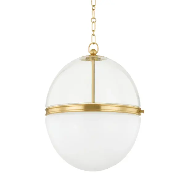 The Donnell pendant combines clear and opal glass separated by an aged brass band for a refined, layered look. Its dual-glass design creates beautiful ambient and task lighting, making it ideal for kitchen islands and dining spaces.