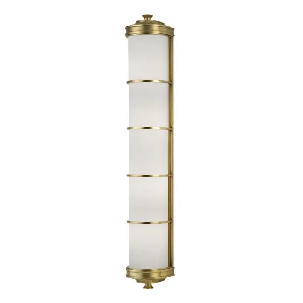 Albany brings architectural grandeur to your walls with faceted gothic details inspired by European cathedral design. The hand-worked aged brass finish and quality opal glass create a sophisticated statement piece that bridges historical inspiration with contemporary refinement.