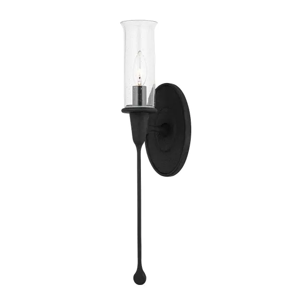 The Chisel wall sconce transforms functional lighting into art with its distinctive elongated holder that creates a striking dripping effect. Clear glass shades showcase the hand-crafted metalwork while providing ambient illumination.