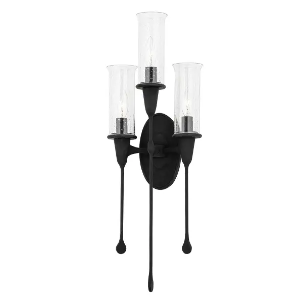 The Chisel wall sconce transforms functional lighting into a conversation-starting art piece. Its distinctive elongated form with hand-crafted details and clear glass shades creates visual drama while providing ambient illumination.