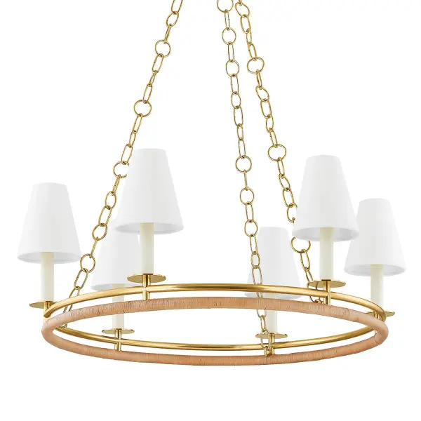 The Swanton chandelier beautifully blends aged brass and natural rattan in a distinctive double-ring design. White linen shades create a light, nautical aesthetic perfect for coastal or transitional spaces. The mixed materials add visual interest and warmth.