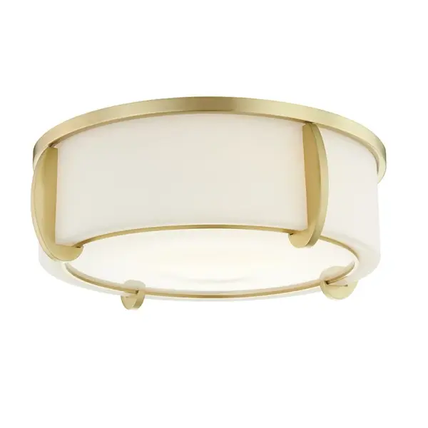 The Talon flush mount delivers contemporary style in a compact 5-inch profile, making it ideal for rooms with standard ceiling heights. The aged brass finish adds warmth while opal glass provides soft, diffused light.