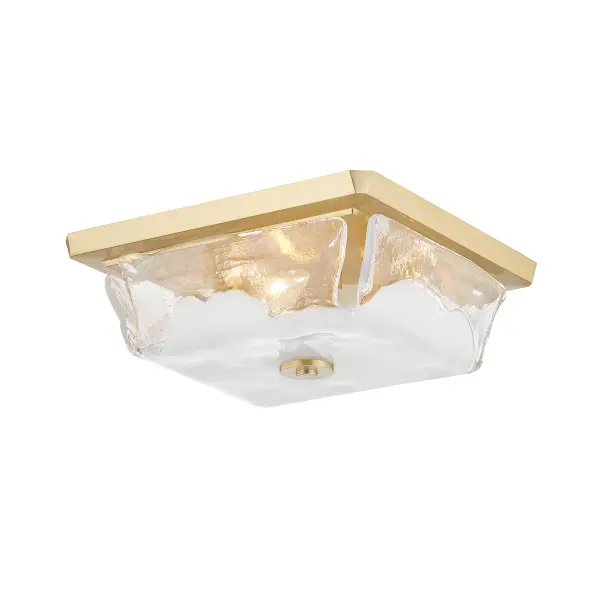 The Hines flush mount delivers refined style in a low-profile design. Its aged brass finish and glass shades provide warm ambient lighting ideal for spaces with standard ceiling heights.