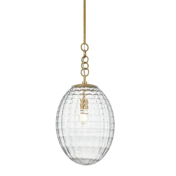 The Venice pendant captivates with its distinctive egg-shaped quilted glass shade that creates rich textural dimension and soft, diffused light. The aged brass finish adds warmth while the unique billowy glass design serves as both functional lighting and artistic focal point.