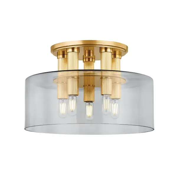 The Crystler flush mount delivers contemporary elegance through its cluster of elongated brass socket cups piercing smoke glass. Its compact 15-inch diameter packs substantial light output while maintaining a sleek profile.