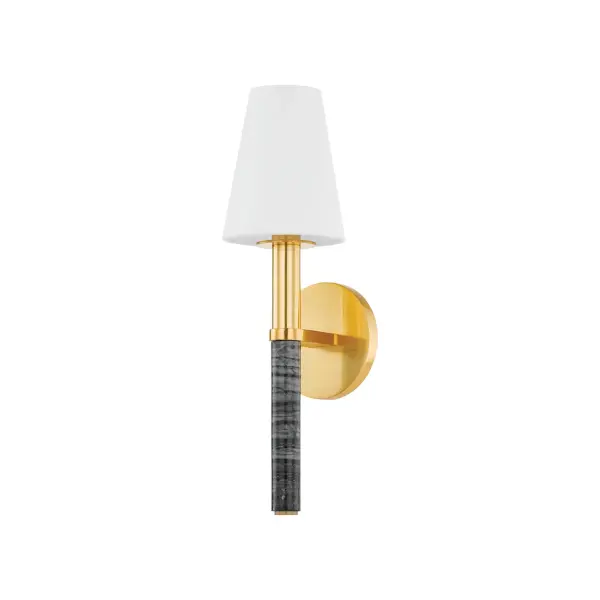 The Montreal wall sconce beautifully merges contemporary design with natural luxury through its striking Nero Modera marble candle sleeve and warm Aged Brass finish. The tapered white linen shade softens the light while the natural stone adds organic texture and visual interest to any space.