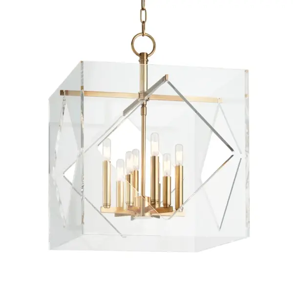 The Travis chandelier combines classic proportions with contemporary clean lines. Its aged brass finish adds warmth while the clear glass shades provide ample illumination. Perfect for transitional spaces seeking sophisticated lighting.