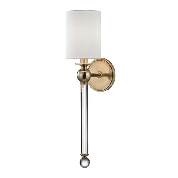 The Gordon wall sconce combines classic proportions with contemporary simplicity. Its elongated silhouette and aged brass finish bring warmth and sophistication to any space, while the glass shade provides soft, ambient lighting.