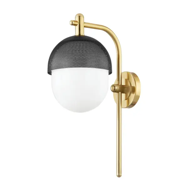 This single-light wall sconce combines aged brass and black finishes for a refined, versatile look. Its compact profile and transitional design make it suitable for both traditional and contemporary interiors.