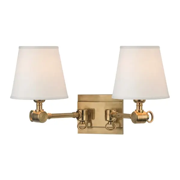 The Hillsdale sconce brilliantly merges vintage industrial functionality with modern sophistication. Its cast swivel mechanism offers exceptional adjustability, while custom linen shades provide soft, ambient illumination perfect for reading or accent lighting.