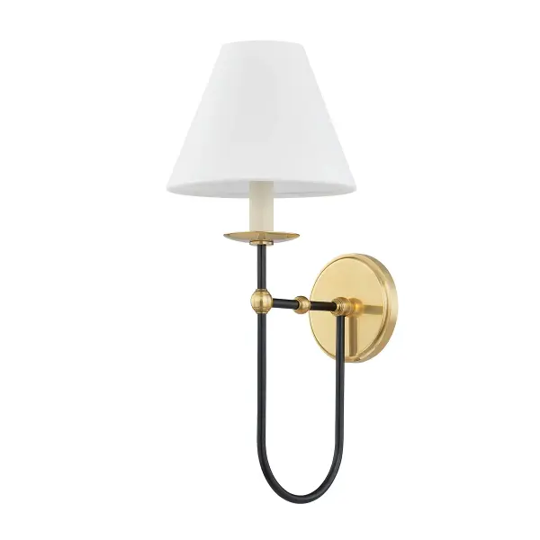 This single-light wall sconce combines aged brass and distressed bronze finishes for a sophisticated, layered look. The mixed-metal aesthetic works beautifully in transitional and contemporary spaces, offering versatile style.