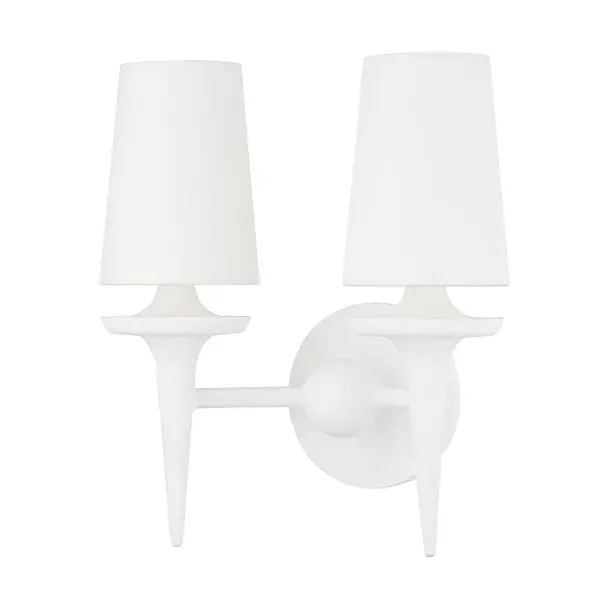 The Torch wall sconce reimagines traditional forms with sleek, sculptural arms and a sophisticated white plaster finish. Belgian linen shades provide soft, diffused light while the monochromatic palette creates a refined, contemporary aesthetic.
