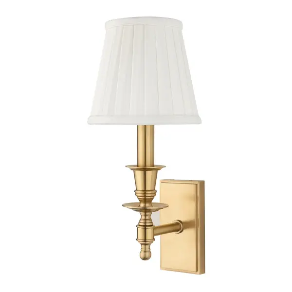 The Ludlow wall sconce combines timeless brass craftsmanship with a soft faux silk shade, delivering warm ambient lighting perfect for intimate spaces. Its compact 5.5-inch width makes it ideal for narrow hallways and powder rooms.
