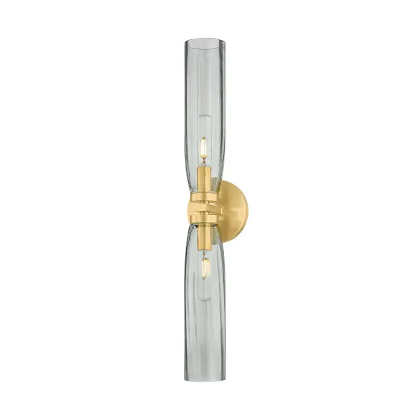 The Harpswell bath sconce beautifully balances architectural precision with organic form. Its elongated smoke glass shades create a warm ambient glow, while the aged brass finish adds vintage sophistication to modern bathrooms.