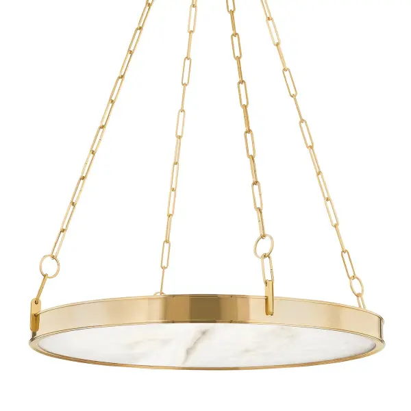 The Kirby chandelier combines minimalist design with luxurious materials. Its alabaster diffuser provides warm, even illumination while the stepped metal frame and distinctive paperclip chain add architectural interest.