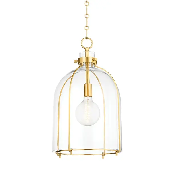 The Eldridge pendant combines clean minimalist design with industrial charm. Its open cage structure and clear glass shade create visual lightness while the aged brass finish adds warmth and sophistication.