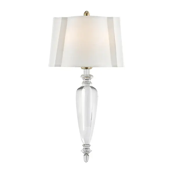 The Tipton wall sconce combines classic proportions with contemporary simplicity. Its aged brass finish and faux silk shades create a sophisticated, warm glow perfect for bedrooms and living spaces.
