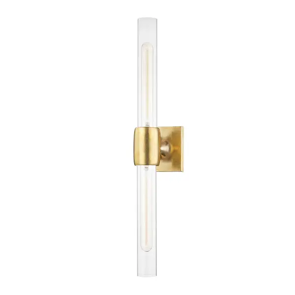 The Hogan wall sconce combines clean lines with tactile interest through its pitted cast-metal details. Clear glass shades provide abundant illumination, making it ideal for task lighting in bathrooms or ambient lighting in hallways.