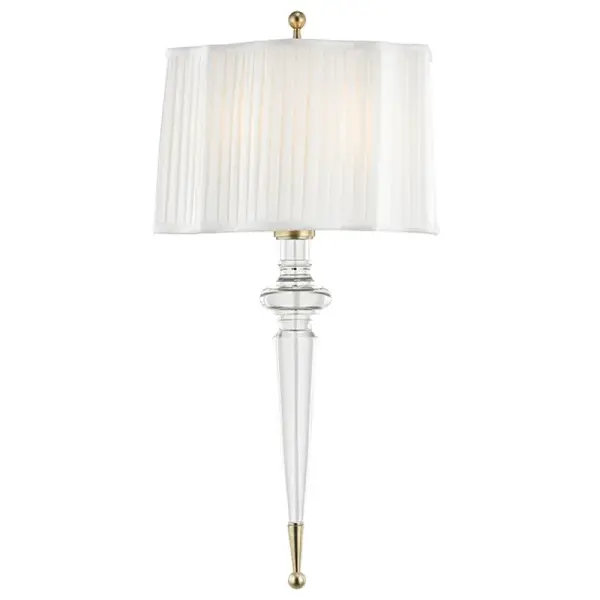 The Tipton wall sconce combines classic proportions with contemporary clean lines. Its aged brass finish and dual candelabra lights create warm, flattering illumination ideal for vanity and hallway applications.