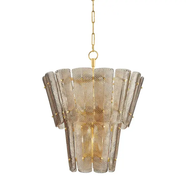 The Cassian chandelier brings Parisian elegance with its graceful tiered design featuring fluted glass plates secured by delicate pins. The optic chevron pattern adds textural depth while the vintage gold leaf finish provides warmth and sophistication.