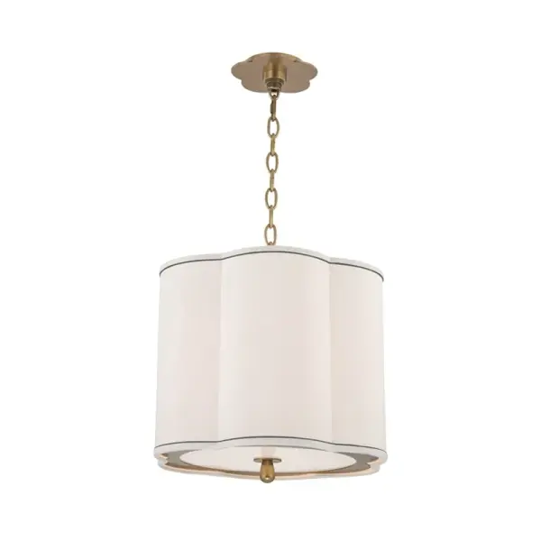 The Sweeny pendant combines classic elegance with contemporary simplicity. Its aged brass finish and faux silk shades create warm, diffused lighting perfect for dining spaces. The 15-inch diameter provides substantial presence without overwhelming.