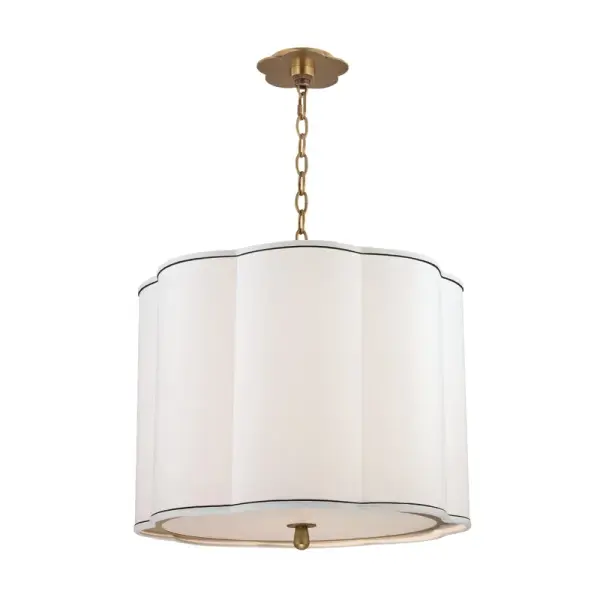 The Sweeny pendant combines classic elegance with contemporary sensibility. Its aged brass finish and faux silk shades create a sophisticated focal point that works beautifully in both traditional and modern spaces.