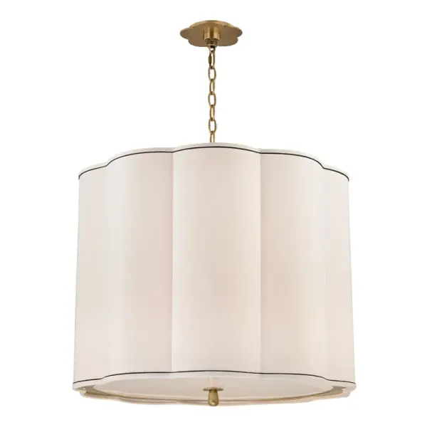 The Sweeny chandelier combines classic elegance with contemporary proportions. Its aged brass finish and faux silk shades create warm, diffused light perfect for dining spaces. The 25-inch width suits medium-sized rooms without overwhelming.