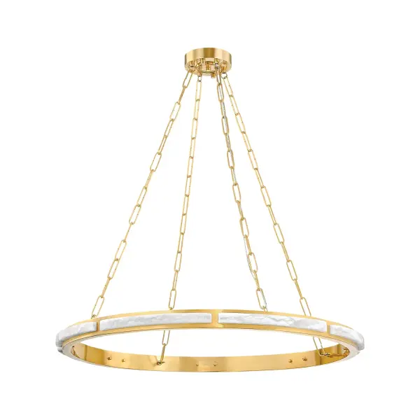 The Wingate chandelier combines organic alabaster with refined aged brass in a striking 36-inch ring design. Integrated LED lighting creates a warm, ambient glow that illuminates the natural stone while reflecting off the brass finish.