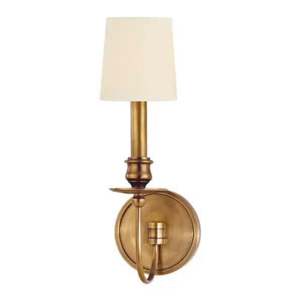 The Cohasset wall sconce brings authentic colonial charm with its curved arm design, candlecup styling, and distinctive ringed ball anchor. The aged brass finish adds warmth and character to traditional and transitional interiors.