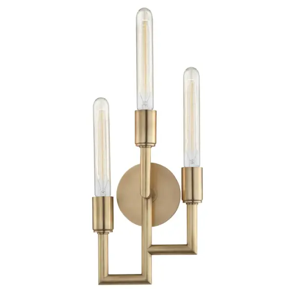 The Angler wall sconce delivers focused task lighting with contemporary style. Its aged brass finish adds warmth while the compact 7.75-inch width fits tight spaces. Three lights provide ample illumination for vanities and hallways.