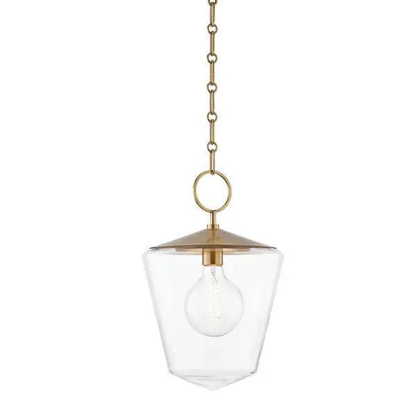 The Greene pendant combines classic aged brass finish with a clear glass globe for a refined look that works in both traditional and contemporary spaces. Its compact 11.75" diameter makes it ideal for smaller areas or grouped installations.