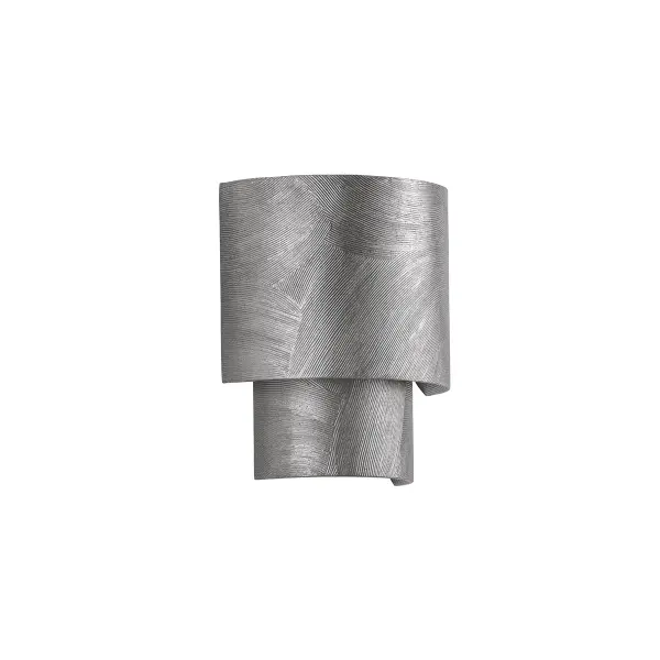 The Moray sconce brings sculptural sophistication to any wall with its nested metal panels and painterly Black Silver Leaf finish. Perfect for creating symmetry in pairs or rhythm along hallways.