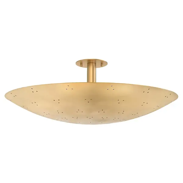The Bern flush mount combines minimalist design with dramatic lighting effects. Its perforated disc shade creates a captivating starry pattern when illuminated, while the vintage brass finish adds warmth and sophistication to contemporary spaces.