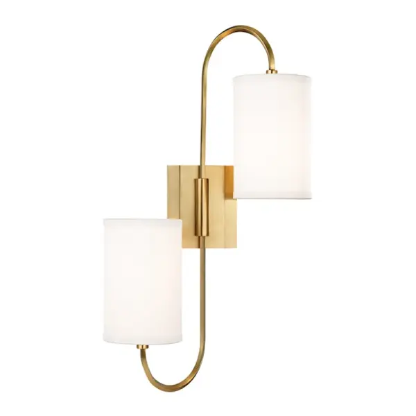 The Junius sconce features a graceful swan-like arm with faceted crystal accents and bidirectional lighting. Its swiveling capability and balanced design make it a versatile choice for spaces needing both ambient and task lighting.