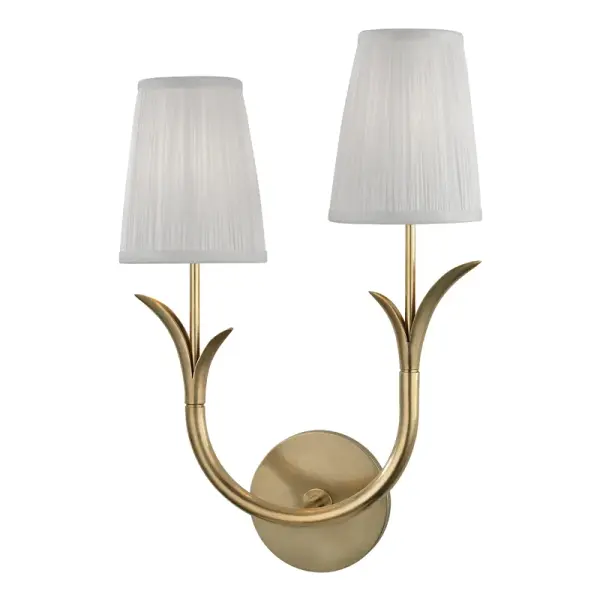 The Deering wall sconce delivers versatile ambient lighting with a refined transitional aesthetic. Its aged brass finish and compact 11-inch width make it ideal for flanking mirrors or creating symmetrical lighting schemes.