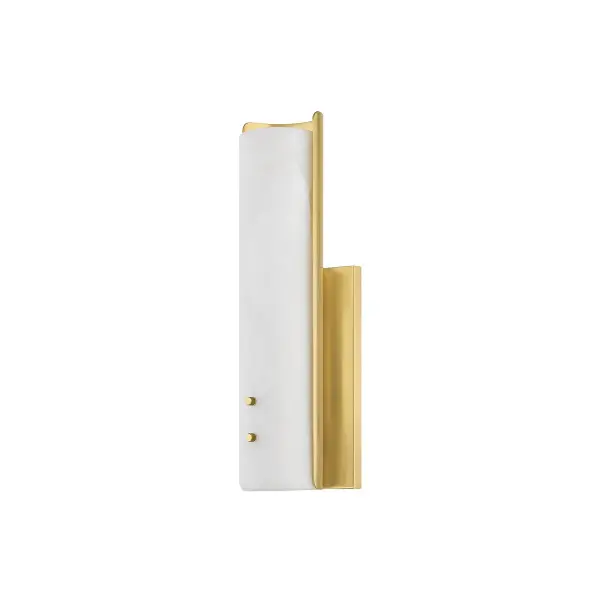 The Lucio wall sconce combines upscale minimalism with natural materials. Its alabaster bar framed in aged brass metalwork creates a sophisticated look that transitions seamlessly from living spaces to bathrooms.